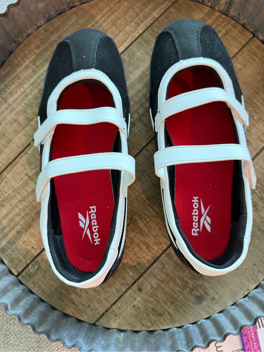 Reebok women’s Black and White Mary Jane Sneakers with Red Insole